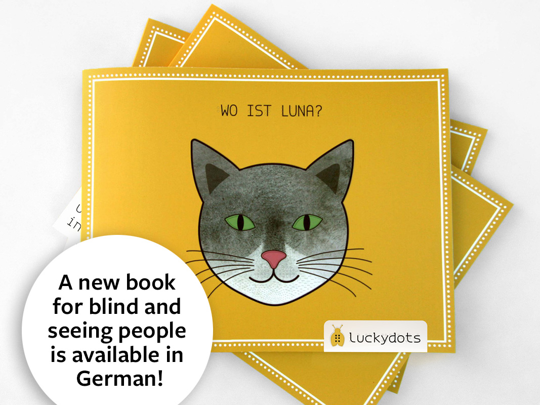 Freindly cat on yellow book cover (C) Anna Weinzettl